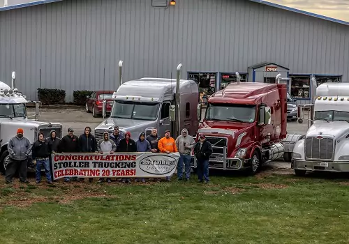 Stoller Trucking employees are seen celebrating the firm's business anniversary. 