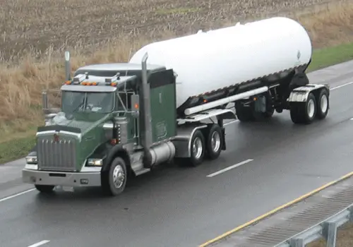 A truck from Stoller Trucking, one of the top Midwest Freight Companies, drives down a highway